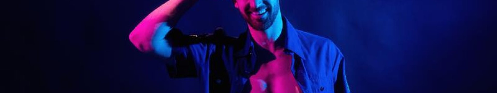 Male stripper against a dark background