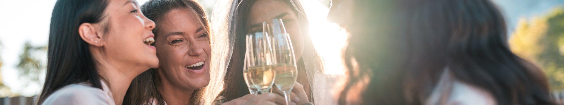 a group of friends chatting and drinking on a hen weekend