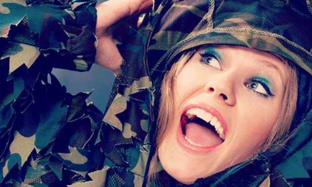 Surprised lady in camo gear. Discover our Adrenaline and Adventure hen party activities: