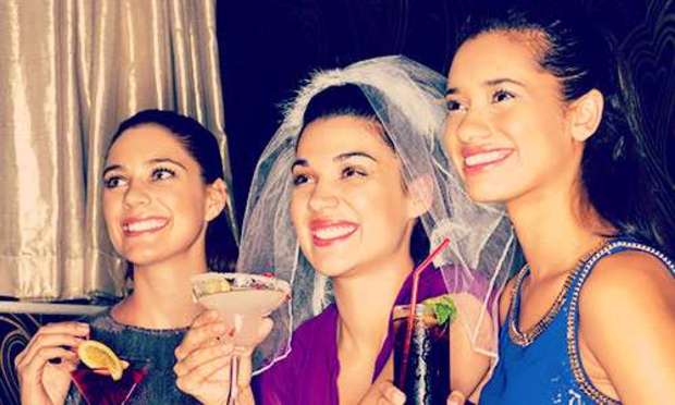 Hen party having cocktails and the bride's wearing a veil. Discover our hen party Entertainment options today: