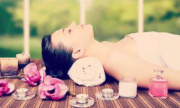 Brunette lying down relaxing. Explore a European Spa Break for your hen weekend: