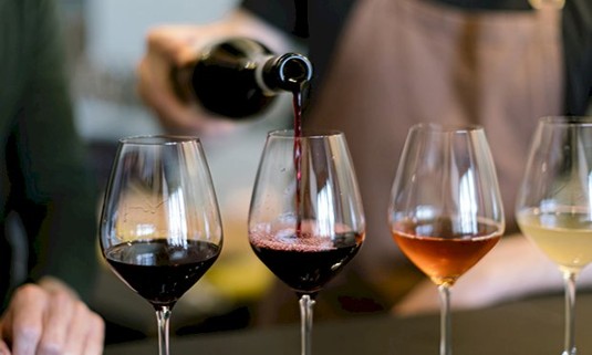 Three glasses of wine ready for tasting.