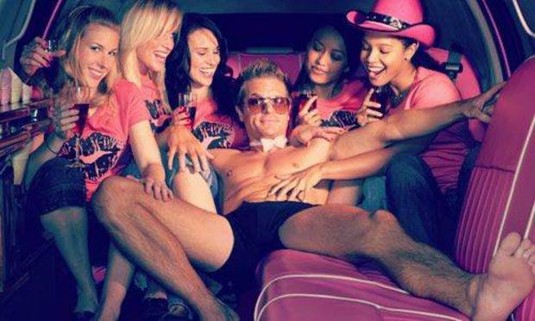 Girls in a hen party fawning over a stripper in a limo. Discover the Ayia Napa Limo and Stripper combo on your hen do:
