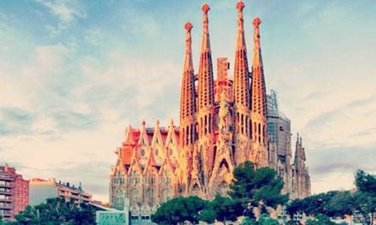 Looking at Sagrada Familia through the park. Explore the Barcelona Go Car Tour for hen weekends: