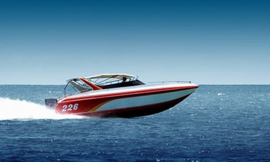 An image of a private jet boat going through the sea 