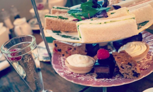 Drinks ordered by a hen party wait to be picked up on a bar. Discover the Bournemouth Tipsy Tea experience: