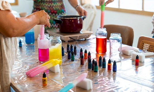 Ladies Painting candles.