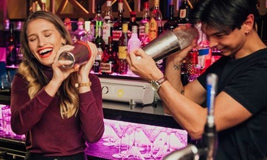 Girls making cocktails on a hen party weekend
