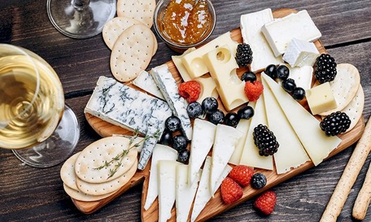 A charcuterie board with prosecco