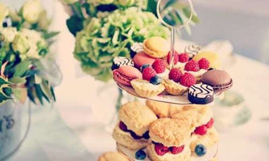 Dainty cakes and homemade scones in a tier. Explore the Lincoln Afternoon Tea for your hen party: