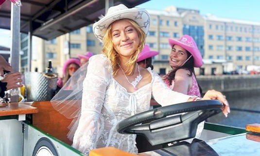 Ten ladies enjoying beer on a joint bike