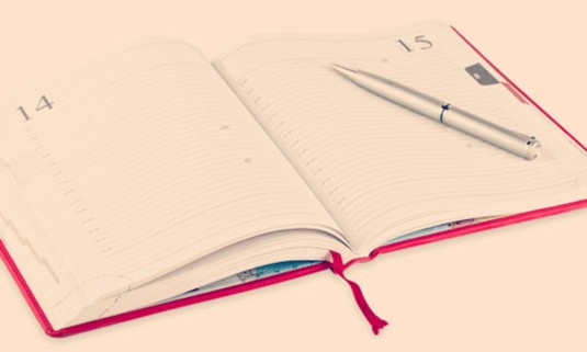Red journal opened to the 15th with a silver pen lying on top. Click to explore the London Bridget Jones Tour activity: