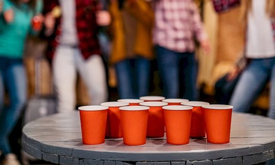 Red cups in a triangle ready for prosecco pong.