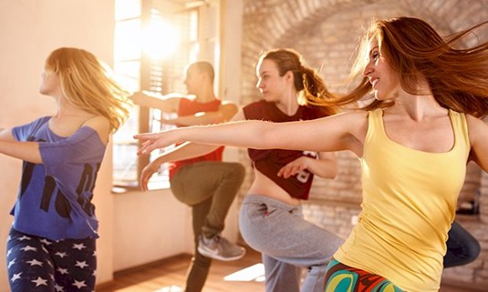 Five ladies taking part in a dance class.