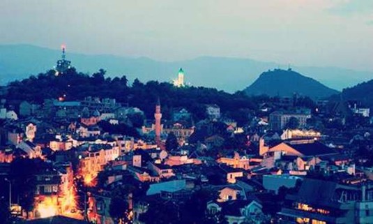 View of the hills where Old Town is lit up at night. Discover Plovdiv Hen Party ideas below:
