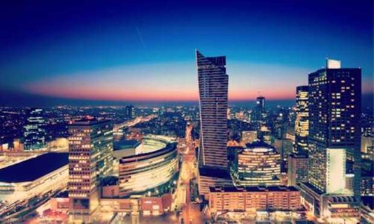 Nighttime view of Europe's second tallest building, the Zlota 44, towering over Warsaw. Explore Warsaw Hen Party ideas below: